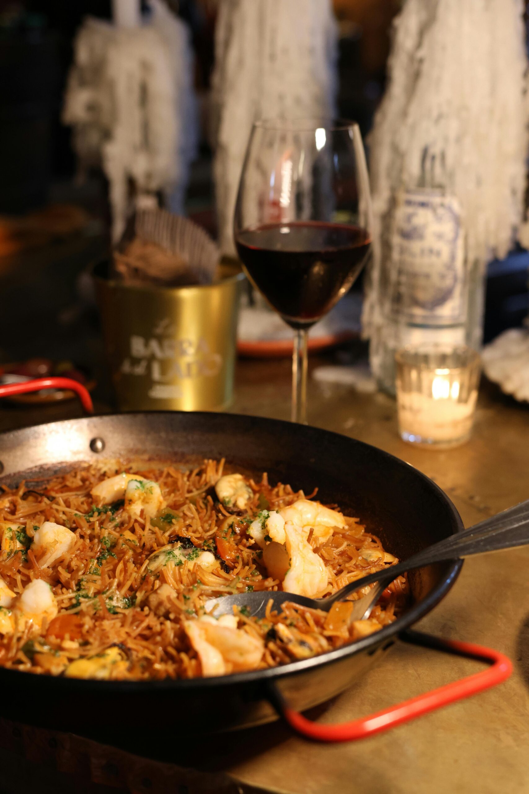 A pan filled with paella and wine